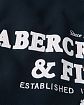 Moscow USA предлагает Вам купить мужскую толстовку на с капюшоном Abercrombie Fitch темно-синего цвета с нашитой надписью и шепрой в капюшоне. Модель 05318. Доставка по России, Москве и области, самовывоз.