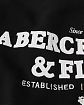 Moscow USA предлагает Вам купить мужскую толстовку на с капюшоном Abercrombie Fitch черного цвета с нашитой надписью и шепрой в капюшоне. Модель 05364. Доставка по России, Москве и области, самовывоз.