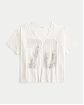 Женская футболка Hollister Oversized бежевого цвета с графикой Нью Йорка и v-образным вырезом. Модель 07766. Подробное описание и цена товара. Бесплатная доставка по России, Москве и Области от Moscow USA