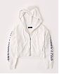 Женская толстовка на молнии с капюшоном Abercrombie Fitch светло серого цвета с надписями на рукавах. Модель 05018. Подробное описание и цена товара. Доставка по России, Москве и Области от Moscow USA