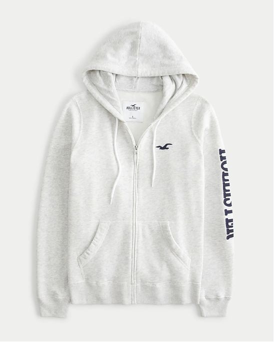 Женская толстовка на молнии с капюшоном Hollister светло-серого цвета с графическим логотипом. Модель 07076. Бесплатная доставка по России, Москве и Области от Moscow USA