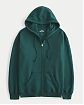 Женская толстовка на молнии с капюшоном Hollister Oversized Feel Good Oversized темно-зеленого цвета. Модель 06975. Подробное описание и цена товара. Доставка по России, Москве и Области от Moscow USA