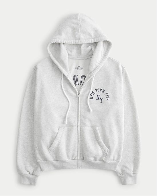 Женская толстовка на молнии с капюшоном Hollister светло-серого цвета с нашитой графикой 07117. Модель 07117. Бесплатная доставка по России, Москве и Области от Moscow USA