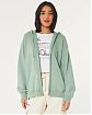 Женская толстовка на молнии с капюшоном Hollister Oversized Feel Good Oversized светло-зеленого цвета. Модель 07119. Подробное описание и цена товара. Доставка по России, Москве и Области от Moscow USA