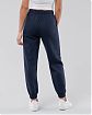 Женские спортивные штаны Hollister Joggers темно-синего цвета с фирменным лого. Модель 6009. Подробное описание и цена товара. Доставка по России, Москве и Области от Moscow USA
