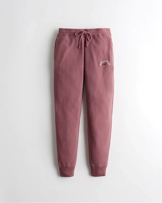 Женские легинсы Hollister Joggers темно-розового цвета с фирменной нашитой надписью и логотипом чайки. Модель 06043. Подробное описание и цена товара. Доставка по России, Москве и Области от Moscow USA