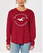 Женская футболка Hollister красного цвета с белой графикой. Модель 06599. Доставка по России, Москве и Области от Moscow USA